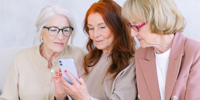 3-women-looking-at-phone.jpg