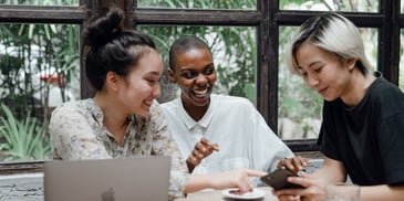 people-laughing-looking-at-phone