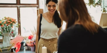 woman-smiling-at-counter