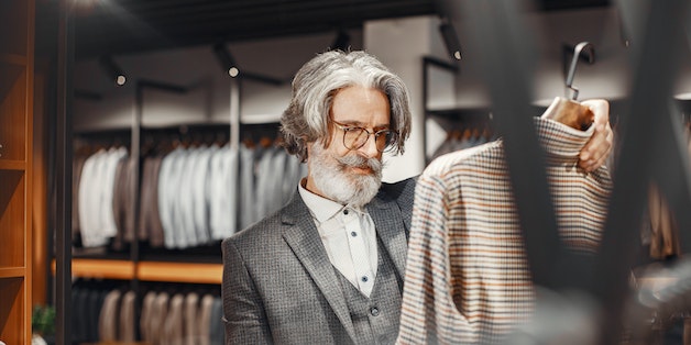 man-looking-at-suit-jacket