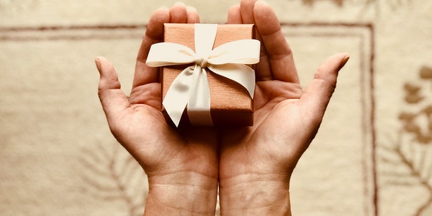 Person-holding-gift-wrapped-box