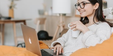 woman-smiling-at-laptop